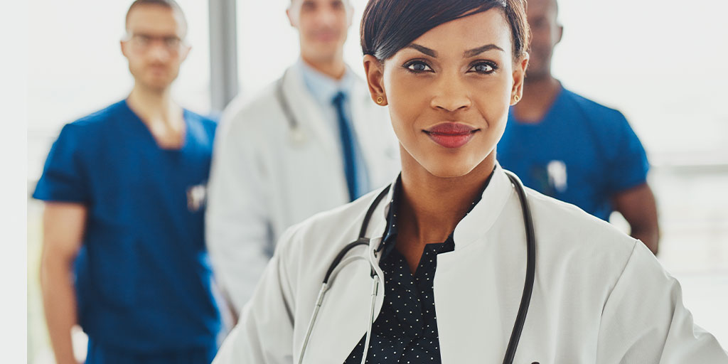 Female doctor in front of other doctors