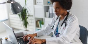 Female doctor on laptop