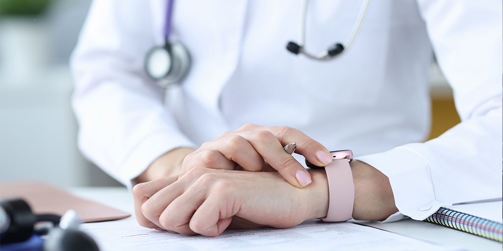 Doctor checking her watch