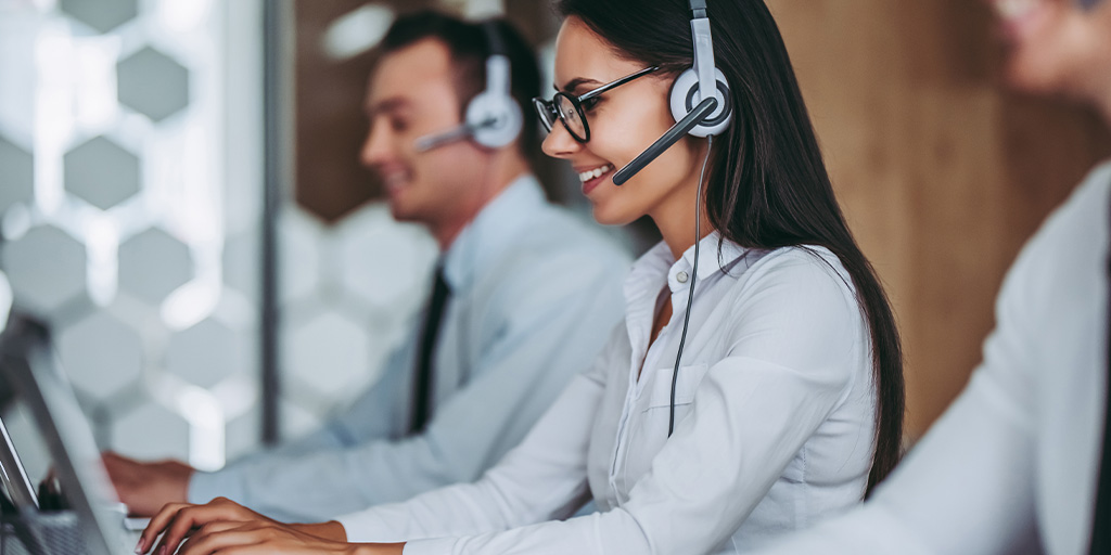 Woman talking to client on headset