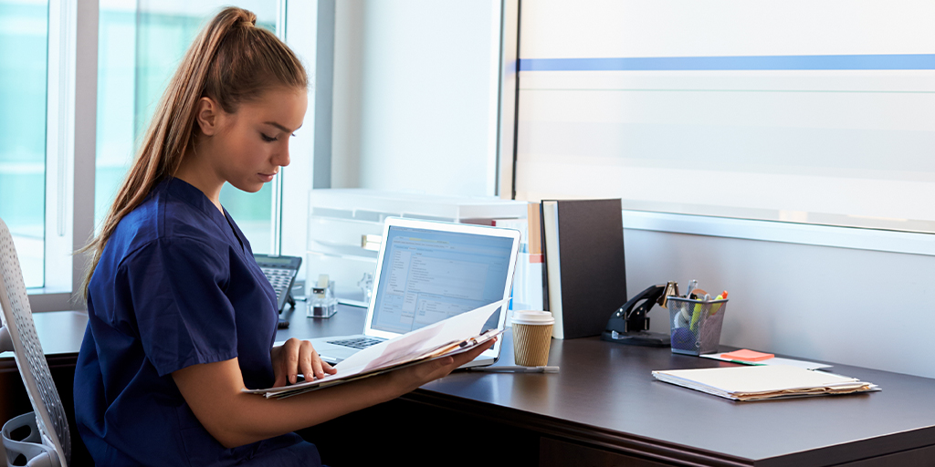 Nurse reading documents