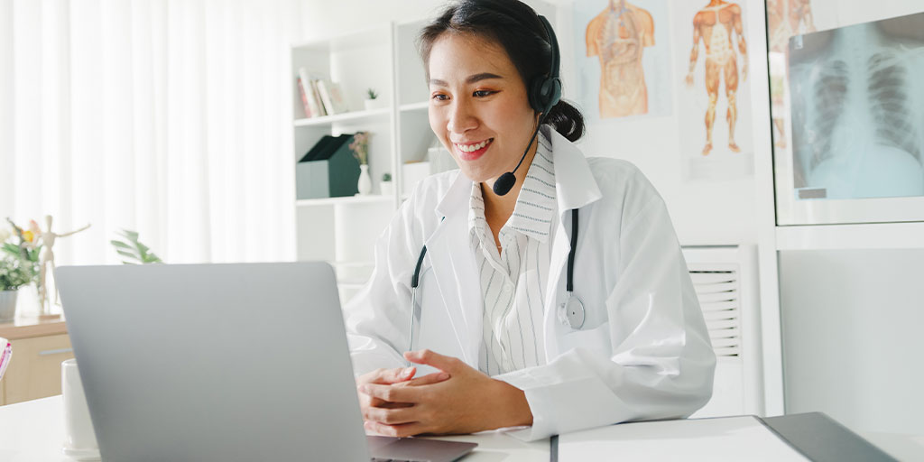 Doctor on headset talking with patient